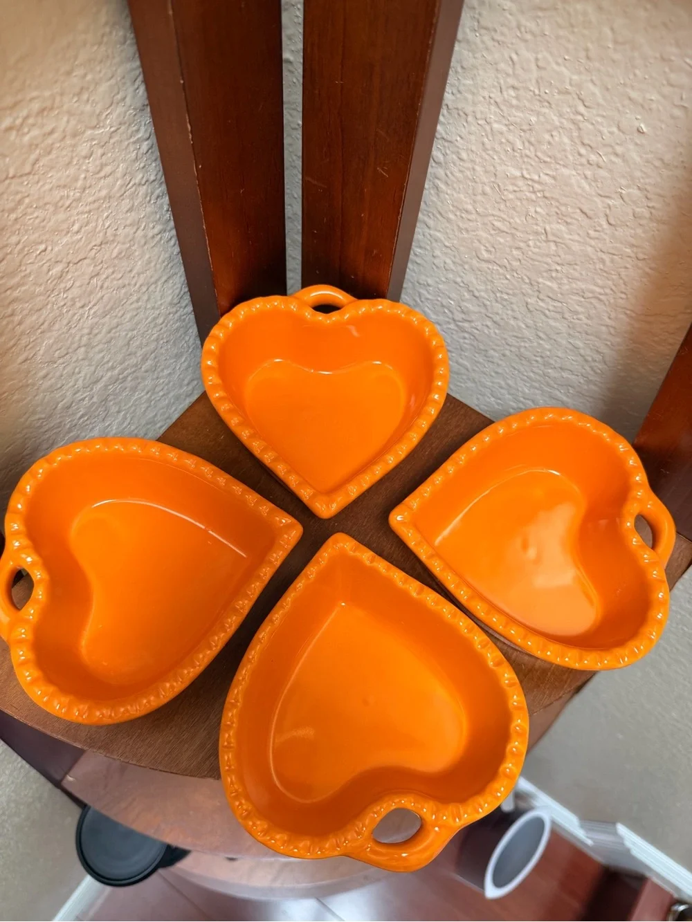 Williams-Sonoma Ceramic Heart-Shaped Dish  Set of 4 in a vibrant glossy orange.